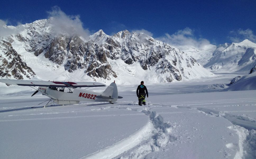 Recovered ACL patient wades through snow back to his airplane in the Alaskan mountains.