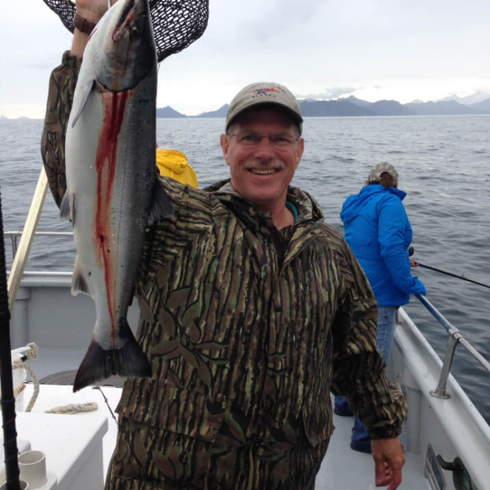 Dr. McNamara fishing in Alaska